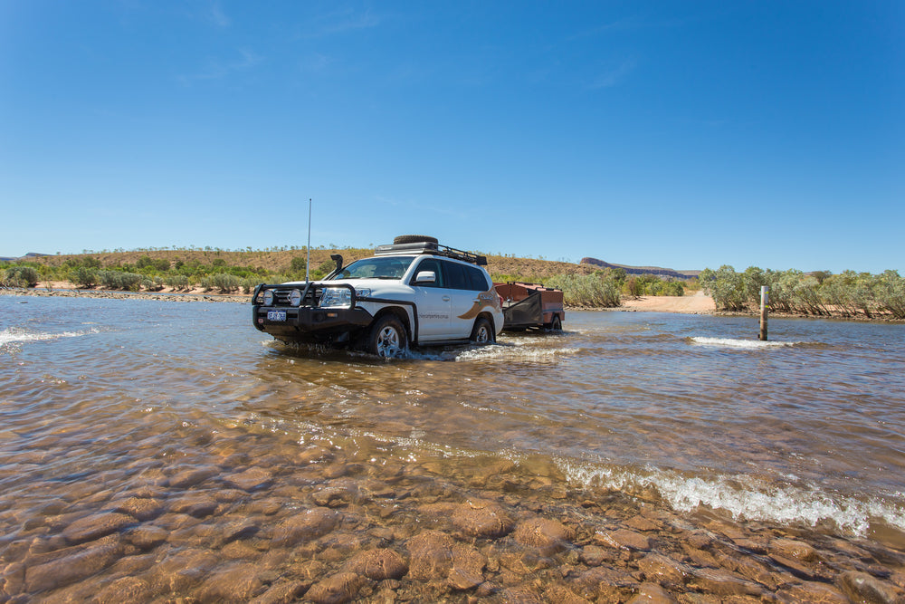 Camper trailer and 4WD driving across water