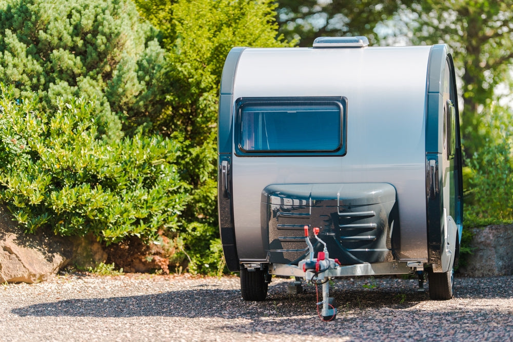 Front on view of an unhitched camper trailer